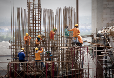 Construction workers building tower block