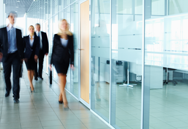 office environment with people walking