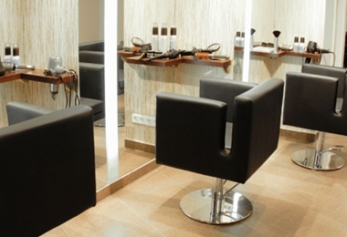 beauty salon with chairs and shampoo bottles
